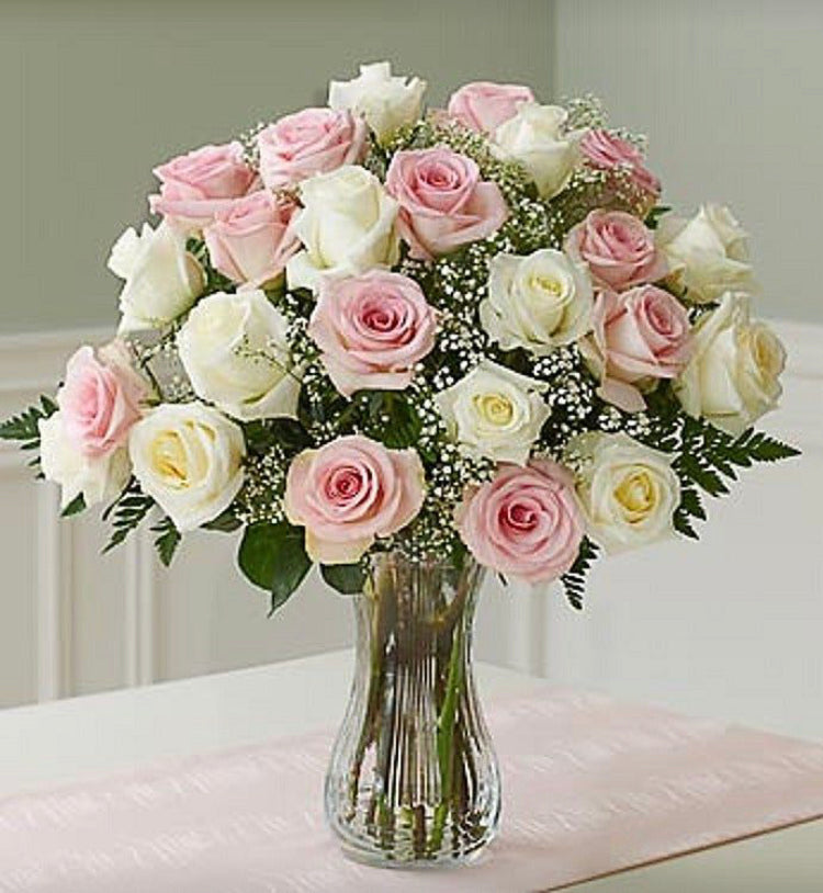 Two dozen pink and white roses